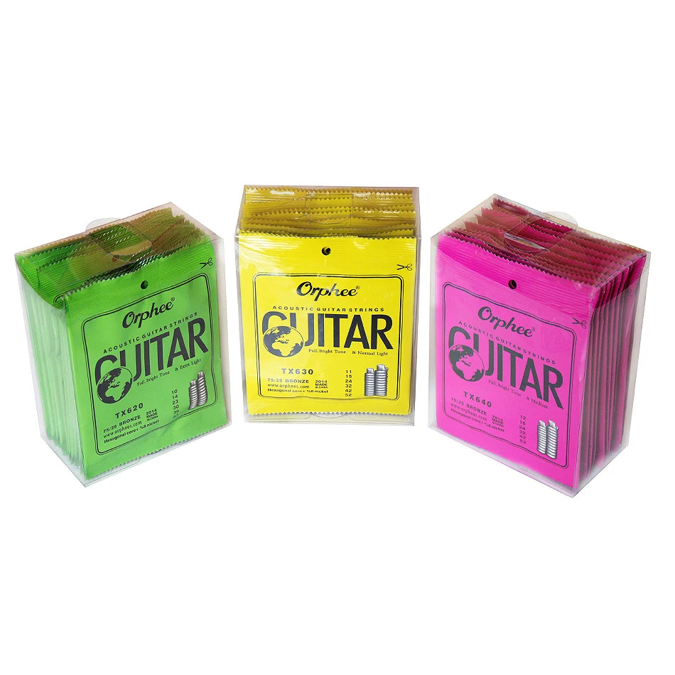 Three packages of Orphee acoustic guitar strings in green, yellow, and pink packaging.