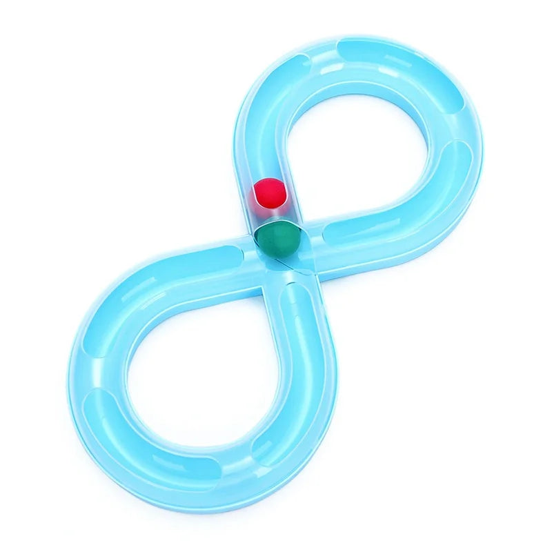 A bright blue interactive cat toy shaped like an 'X' with a tunnel and a red and green teaser wand.