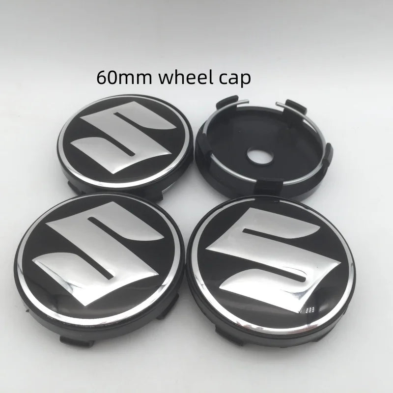 Four 60mm Suzuki wheel cap components including a hub and two caps.