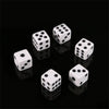 A set of ten white six-sided dice arranged on a black surface.