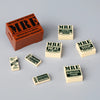 A collection of miniature building blocks shaped like food items including meals ready-to-eat, meat jerky, chocolate dessert,