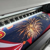 A fabric backdrop featuring a cartoon tiger party design with fireworks and patriotic colors.