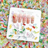 A white card featuring five natural-looking pink nails and various clear acrylic filler pieces scattered around them.