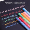 A set of six vibrant acrylic gel pens in various colors are shown writing on a black surface.