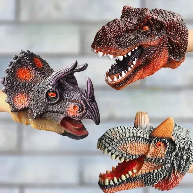 A realistic soft toy of a Tyrannosaurus Rex dinosaur hand puppet with textured skin and open mouth.