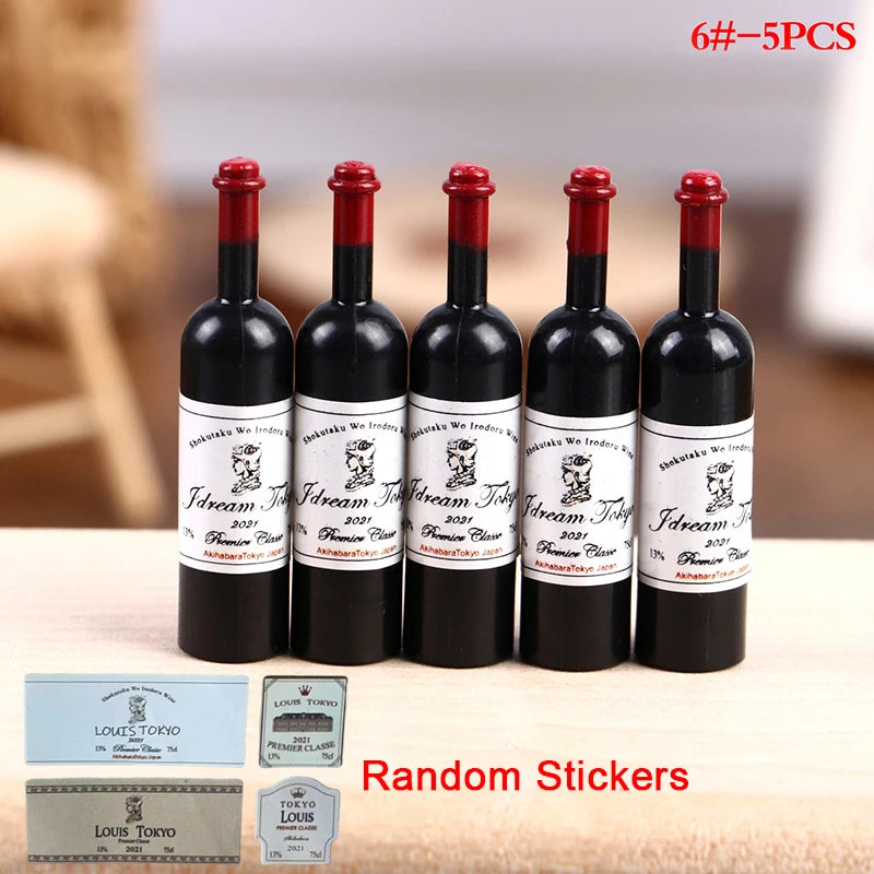 A set of six miniature resin wine bottles with labels and a small cup, used for dollhouse display.