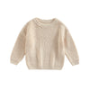 A beige knit pullover sweater for kids with a round neckline and long sleeves.
