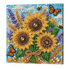A vibrant floral painting kit featuring yellow and purple flowers on a blue background with various beads and a wooden frame.
