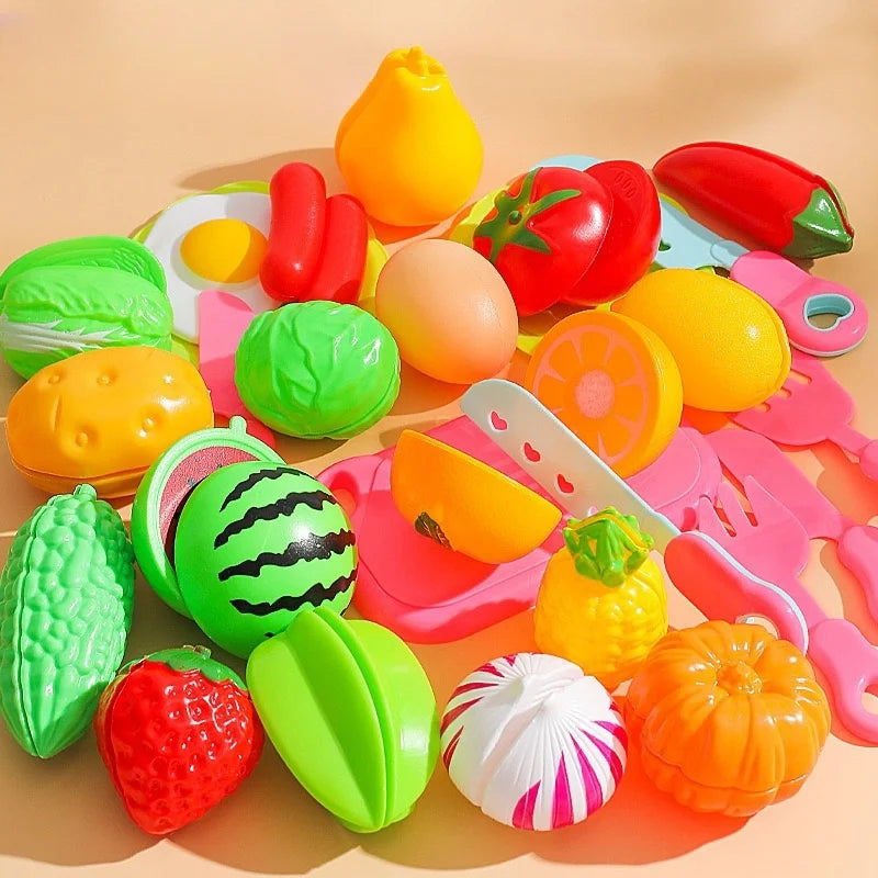 A colorful set of DIY fruit cutting music toys including plastic fruits and vegetables for children.