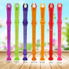 A set of eight colored transparent ABS recorder flutes: purple, green, blue, yellow, orange, red, and pink.
