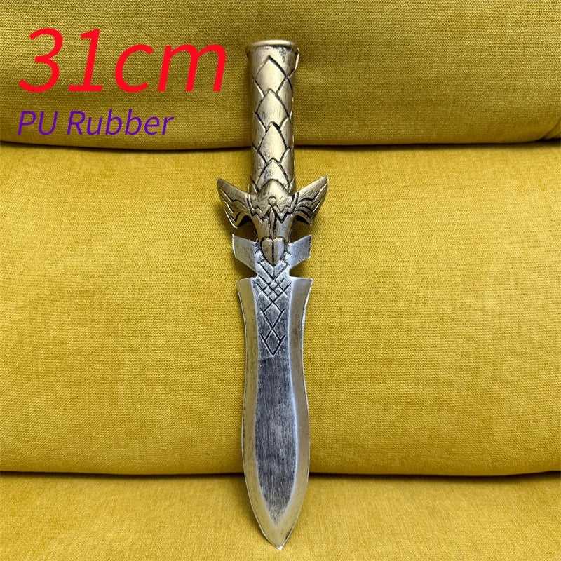 A silver Halloween knight dagger with a sawtooth blade is displayed on a yellow fabric background.