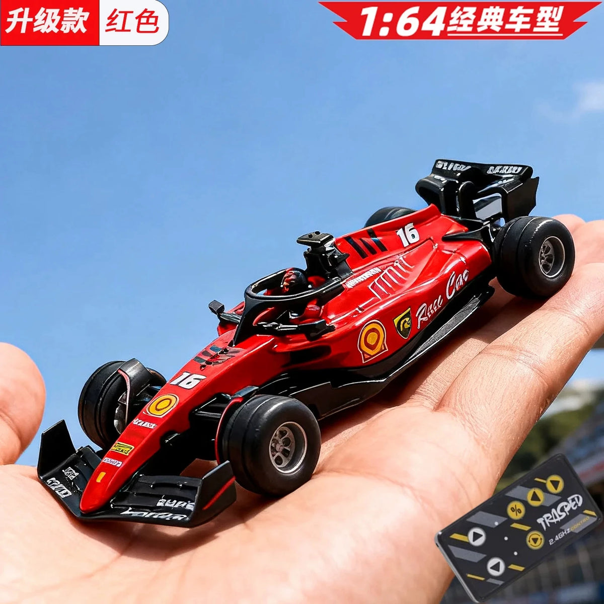 A red 1:64 scale alloy RC drift car is held in a hand against a blue sky background.