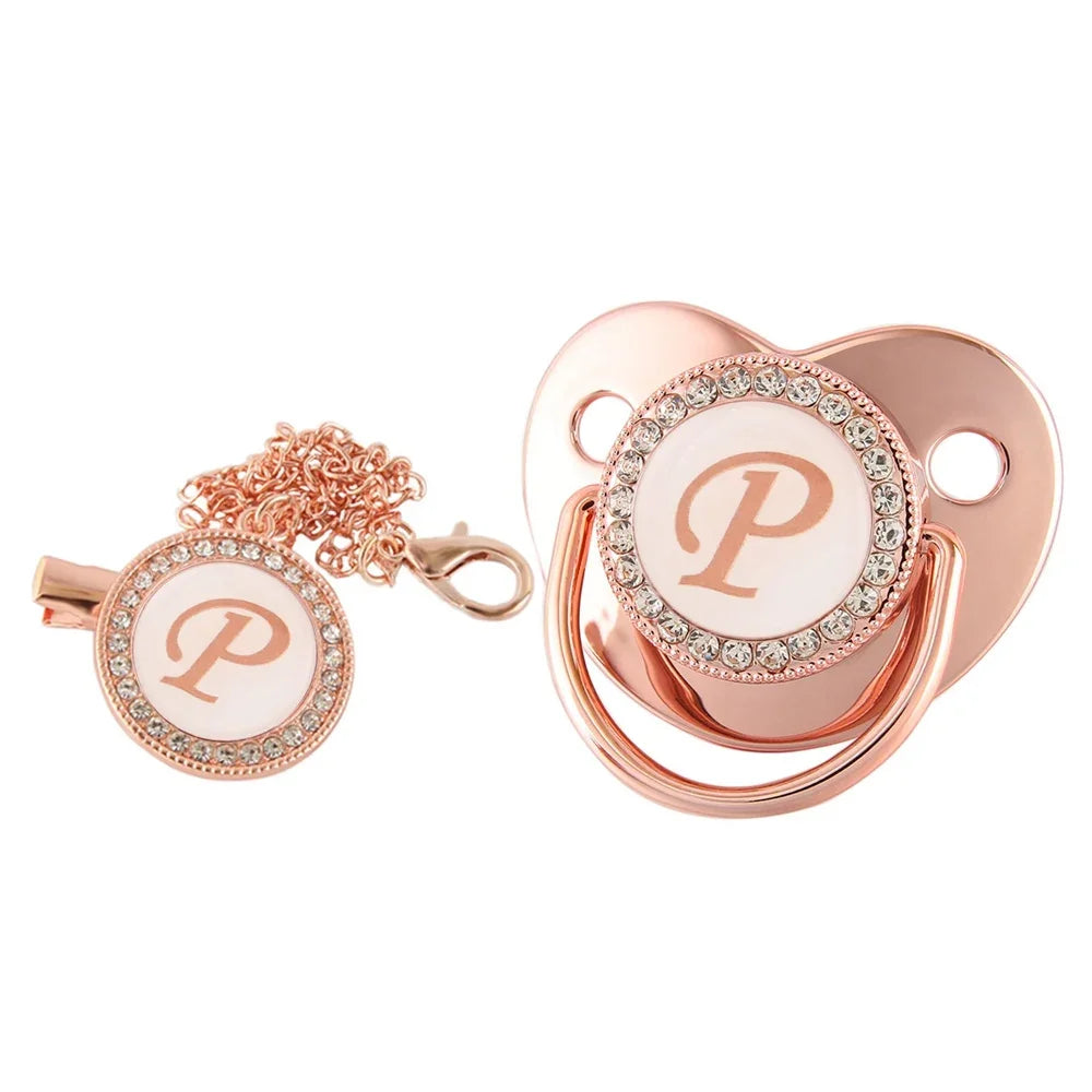 Rose gold bling baby pacifier clip with silicone holder featuring a pearl design.