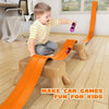 An orange flexible car race track is set up on a wooden block for kids to play.