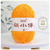 A ball of bright orange chenille yarn labeled with Chinese characters for knitting and crochet.