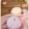 A close-up of fluffy pink mohair yarn showing its soft texture and plush effect.