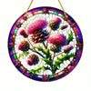 A round acrylic window hanging featuring a detailed, colorful design of pink and purple thistle flowers and leaves.