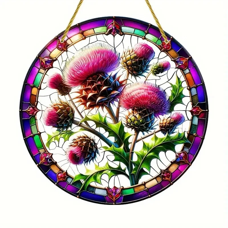 A round acrylic window hanging featuring a detailed, colorful design of pink and purple thistle flowers and leaves.