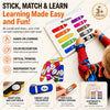 A child is using a colorful learning book with various colored sticks and tools for hands-on education.