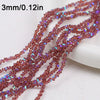 A close-up of reddish-brown crystal triangle beads, 3mm long, strung together for jewelry making.