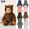 A collection of baby bear fleece hooded rompers in various colors including brown, pink, gray, and green.