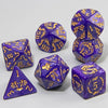 A set of purple polyhedral dice featuring a marble dragon pattern, including a tetrahedron and several other shapes.