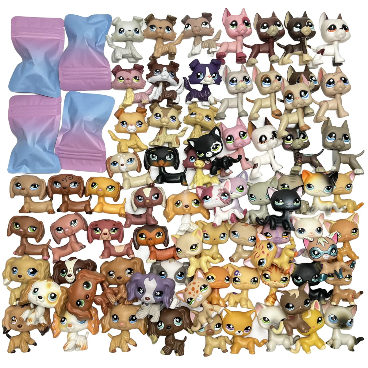 Eine Sammlung von Sammelfiguren von Haustierkätzchen in verschiedenen Farben und Stilen.