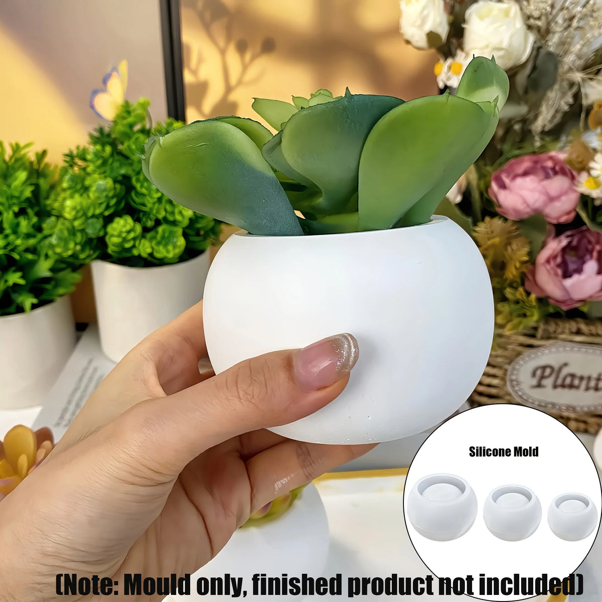 A hand holds a white silicone mold with three round indentations, used for DIY planters or candles.