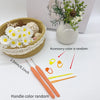 A set of crochet hooks, stitch markers, and needles with random colors displayed next to a woven basket and greenery.