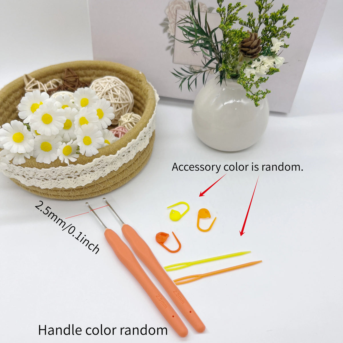 A set of crochet hooks, stitch markers, and needles with random colors displayed next to a woven basket and greenery.