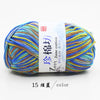 A ball of multi-colored yarn labeled Zun Jane cotton yarn for knitting and crochet with a white and blue tag.