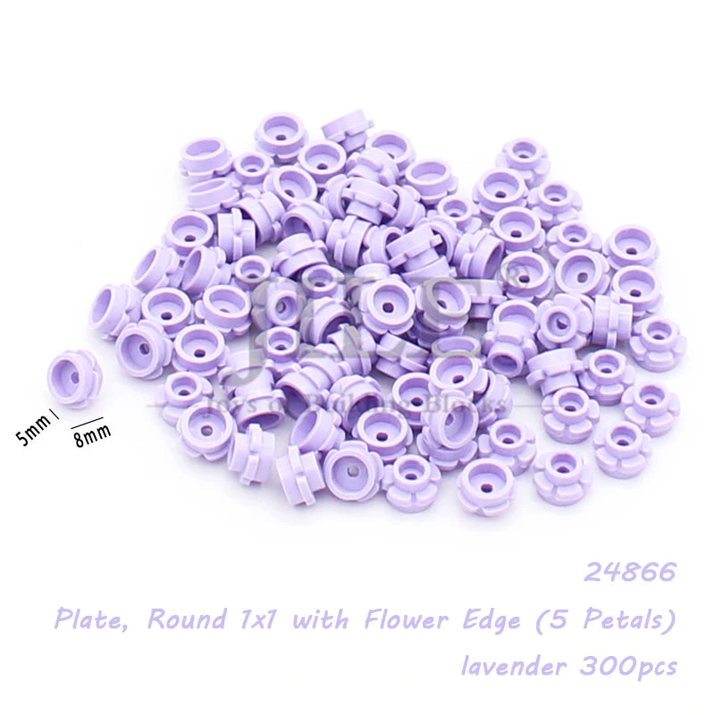 A pile of lavender round plates with a flower edge for building blocks.