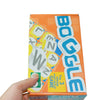 A box of Boggle The 3 Minute Word Search Dice Game with orange and blue packaging being held by a hand.
