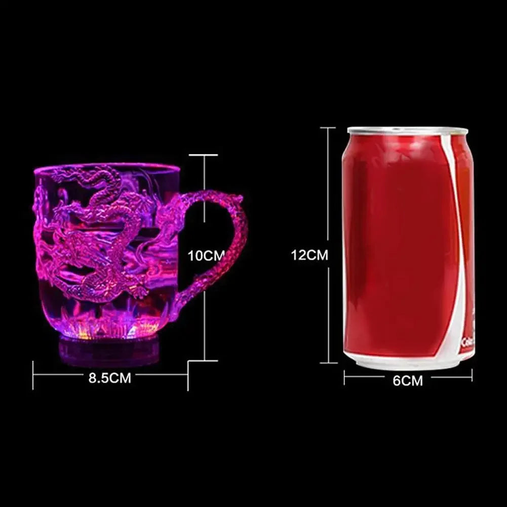 A purple LED light-up dragon mug with a handle and a red can-shaped container are shown side by side.