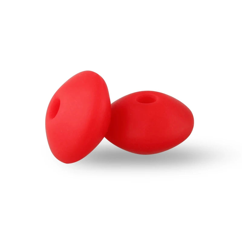 Two bright red silicone lentil beads shaped like an abacus for jewelry making