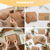 Hands are assembling mini kraft paper envelopes with heart clasps for personalized gifts.