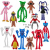 A collection of collectible figures featuring various characters from Poppy Playtime, including pink, green, and orange dolls
