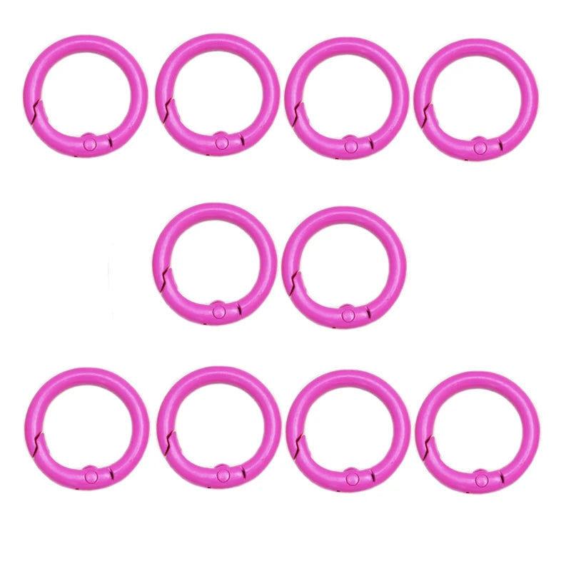 A set of ten bright pink alloy snap hook keychain clips arranged in two rows.
