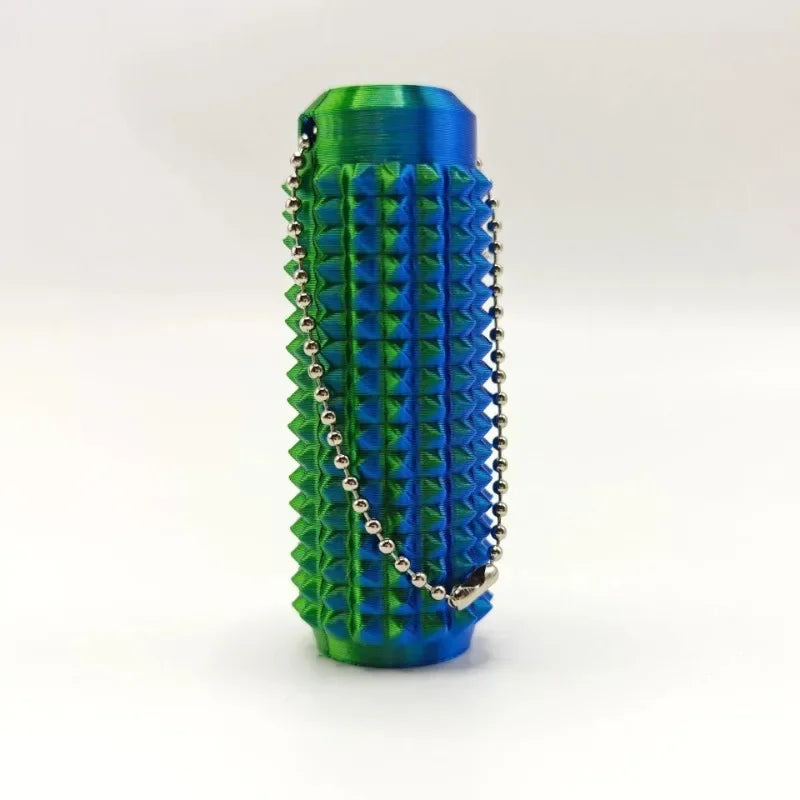 A vibrant blue and green spiky sensory keychain with a silver chain.