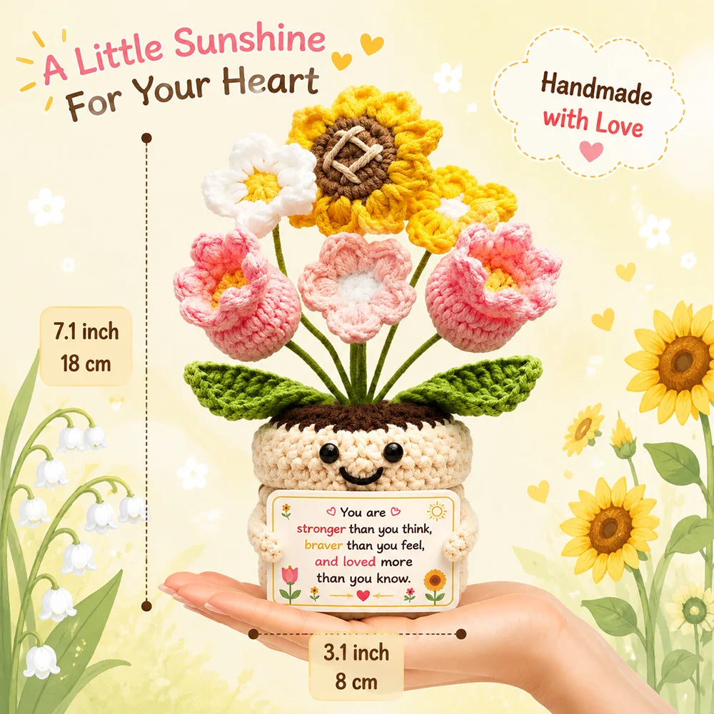 Handmade crochet donkey doll with a motivational card displayed on a hand.