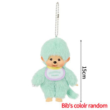A light mint green Monchhichi plush keychain hanging from a chain.
