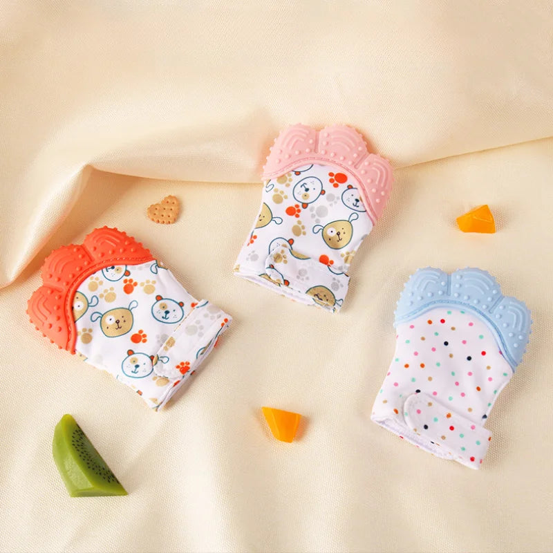 A set of colorful cartoon baby teething mittens in pink and blue for soothing gums