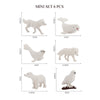A mini set of six white animal figurines including a whale, shark, dolphin, turtle, and penguin.