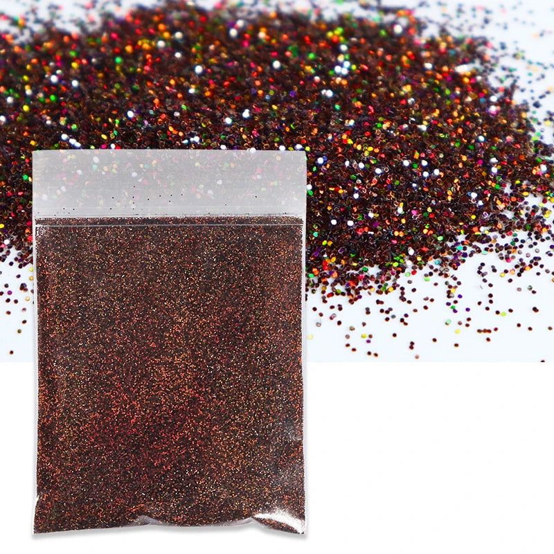 A small plastic bag filled with fine, reddish-brown holographic glitter powder scattered on a white background.