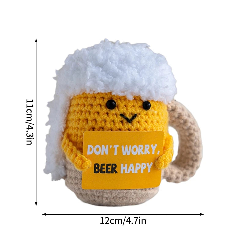 Handmade crochet pocket hug doll with a white fluffy hat and yellow body featuring the text Don't worry beer happy