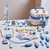 A kids doctor play set featuring a white medical kit, stethoscope, bandages, and various plastic tools for role-playing.