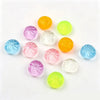 A set of five colorful, translucent squishy toys shaped like dumplings, including yellow, green, pink, and blue varieties.