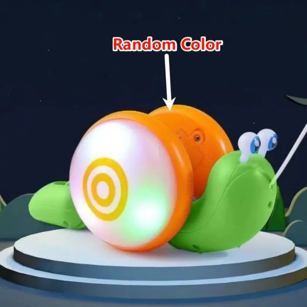 A musical pull-along snail toy with a random color is displayed on a round platform.