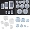 A collection of white geometric resin casting molds for DIY jewelry and crafts in various shapes and sizes.