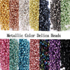 A collection of metallic color delica beads in various shades including gold, copper, silver, and green.